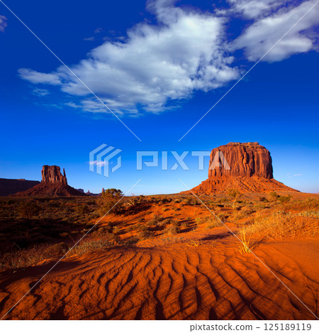 Monument Valley West Mitten and Merrick Butte desert sand dunes Monument Valley West Mitten and Merrick Butte desert sand dunes 125189119