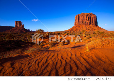 Monument Valley West Mitten and Merrick Butte desert sand dunes 125189168