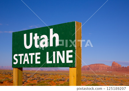 Road sign between Utah and Arizona State Line 125189207