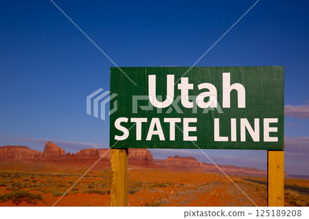 Road sign between Utah and Arizona State Line 125189208