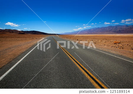Deserted Route 190 highway in Death Valley California Deserted Route 190 highway in Death Valley California 125189314