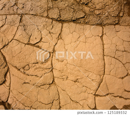 Mesquite Dunes dried clay macro detail in Death Valley Mesquite Dunes dried clay macro detail in Death Valley 125189332