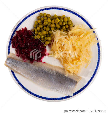 Peas with beets and herring on a plate side view 125189436