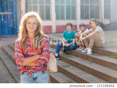 Teenager girl at school building 125189468