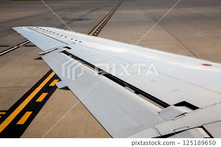 aircraft airplane left wing on airport soil signs aircraft airplane left wing on airport soil signs 125189650