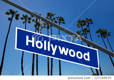 Hollywood California road sign on redlight with pam trees  photo mount 125189670