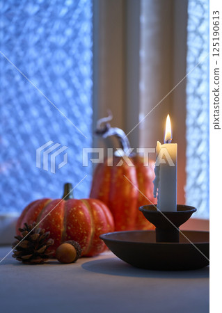 Halloween image of a decorated window at night 125190613
