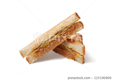 Slices of club sandwich made with meat, cheese and cucumber isolated on white Slices of club sandwich made with meat, cheese and cucumber isolated on white 125190909