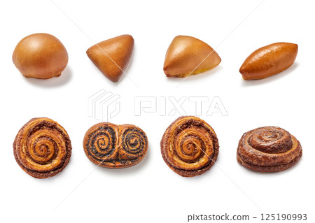 Pattern of homemade buns and pies with poppy and jam isolated Pattern of homemade buns and pies with poppy and jam isolated 125190993