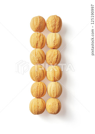 Top view of baked nuts with condensed milk inside isolated on white background 125190997