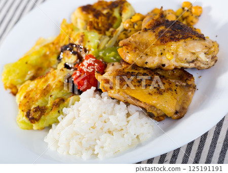 Fried chicken thighs with garnish Fried chicken thighs with garnish 125191191