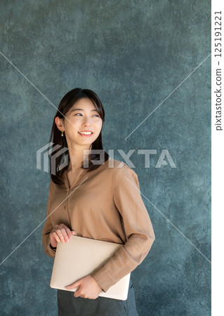 A young lady with a laptop A young lady with a laptop 125191221