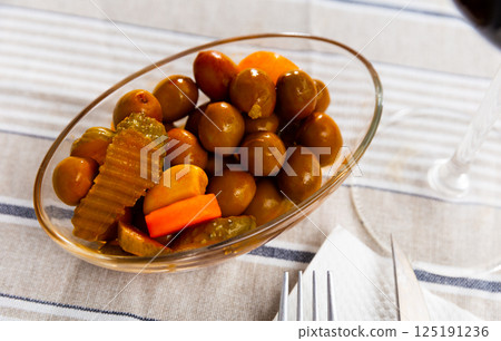 Green olives served with cucumber, carrot, garlic and onion 125191236