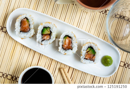 Tasty sushi california roll with salmon and avocado 125191250