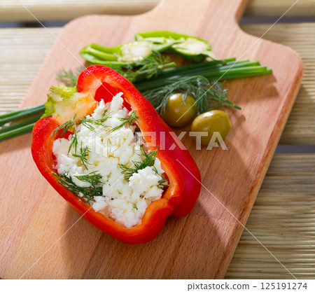 Pepper stuffed with brynza is tasty dish of Bulgarian cuisine Pepper stuffed with brynza is tasty dish of Bulgarian cuisine 125191274