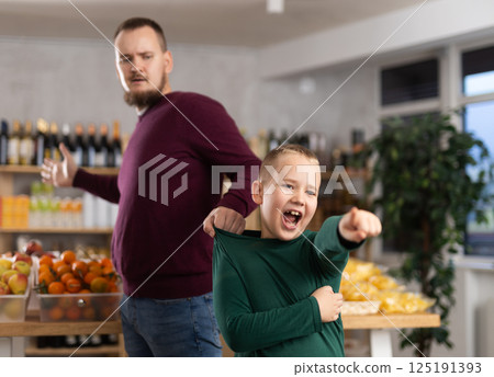 Disgruntled boy asks dad to buy at grocery store 125191393
