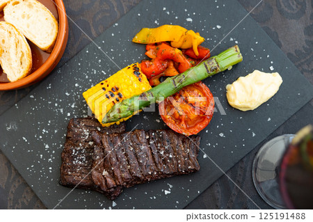 Entrana Argentinean skirt steak, grilled beef with asparagus, corn and tomato Entrana Argentinean skirt steak, grilled beef with asparagus, corn and tomato 125191488