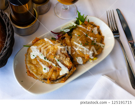 Battered eggplant slices with yogurt sauce Battered eggplant slices with yogurt sauce 125191715