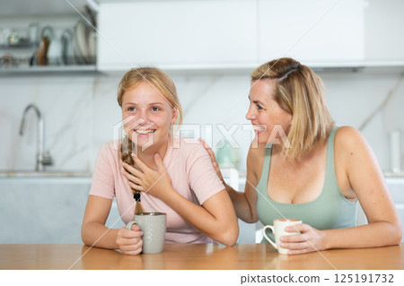 During tea party, girl laugh and tell mother plot of modern new comedy, movies 125191732