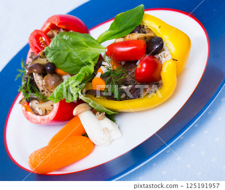 Peppers filled with porcini mushrooms, rice, tomatoes 125191957