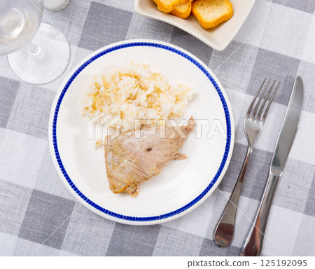 Just prepared fresh tuna fillet with boiled rice Just prepared fresh tuna fillet with boiled rice 125192095