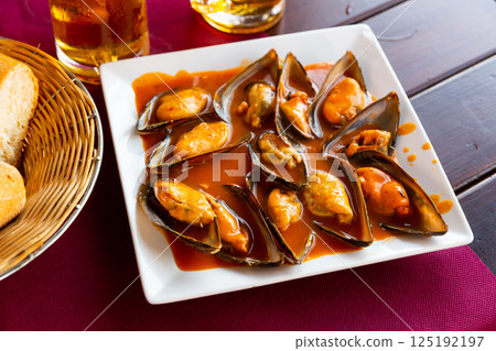 Steamed mussels with red sauce Steamed mussels with red sauce 125192197
