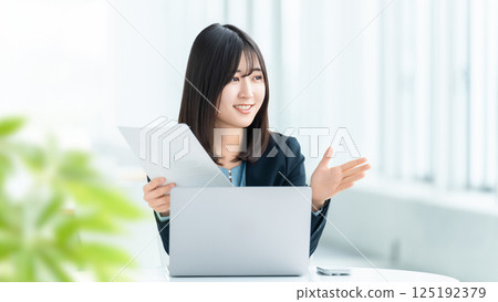 Smiling woman/businesswoman having a conversation Smiling woman/businesswoman having a conversation 125192379