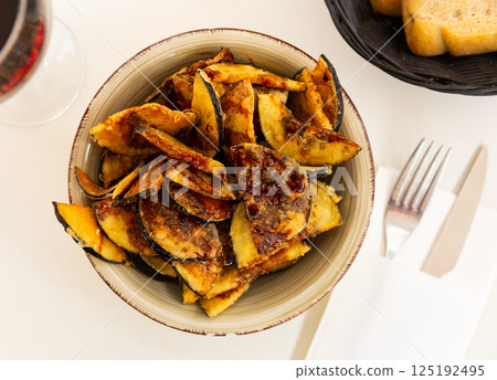 Plate with prepared food eggplants with honey 125192495