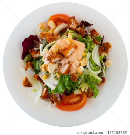 Tasty Caesar salad with tomatoes, corn, olives and fried chicken Tasty Caesar salad with tomatoes, corn, olives and fried chicken 125192685