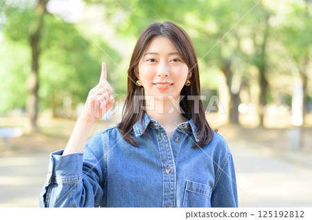 A young woman with a finger A young woman with a finger 125192812