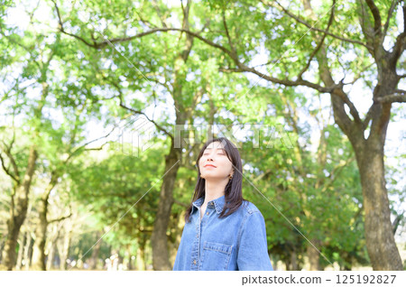 A young woman batting forest A young woman batting forest 125192827