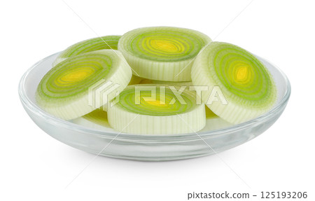 sliced Leek vegetable in glass bowl isolated on white background with full depth of field 125193206
