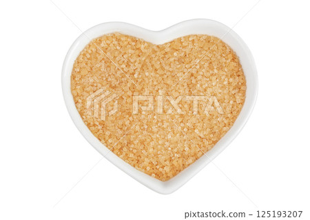 The brown sugar in ceramic bowl isolated on white background. Top view. Flat lay 125193207