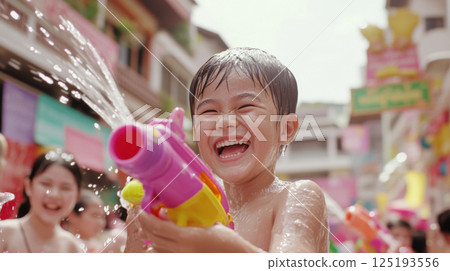 Thai Children celebrating Songkran festival with water fights on street 125193556