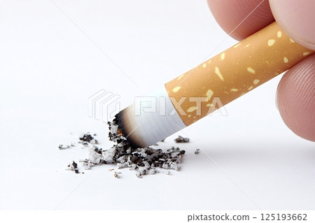 Fingers holding burning cigarette with ash on white background Fingers holding burning cigarette with ash on white background 125193662