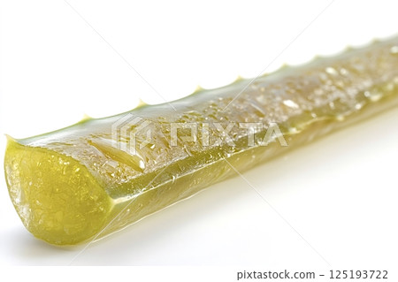 Fresh aloe vera leaf exuding soothing gel on white background 125193722