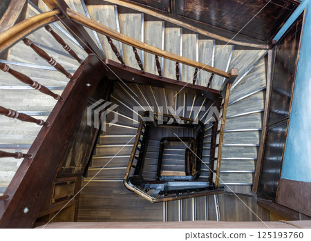 An Intricate and Beautiful Spiral Staircase Captured from Above, Showing its Complex Design 125193760