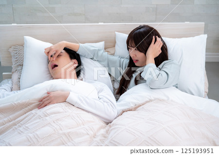 Young woman suffering from snoring Young woman suffering from snoring 125193951