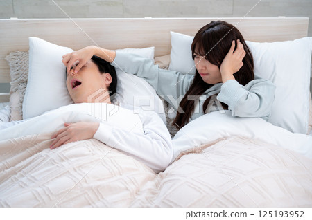 Young woman suffering from snoring 125193952