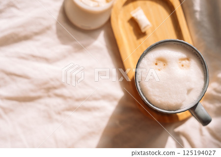 A pouch of snus for breakfast with coffee, morning energy with nicotine A pouch of snus for breakfast with coffee, morning energy with nicotine 125194027