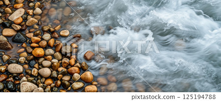 Pebble stones on the bank of a mountain river 125194788