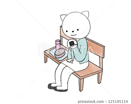 A cat sitting on a bench eating lunch 125195114
