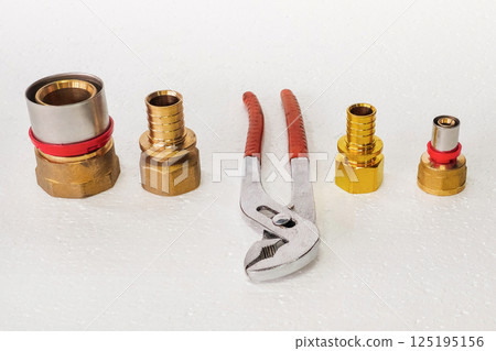 plumbing fittings and adjustable wrenches 125195156