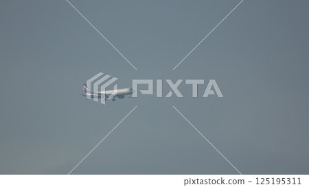 Airplane Flight Sky: High-Altitude Aircraft Transit, Overcast Conditions, Air Travel. Airplane Flight Sky: High-Altitude Aircraft Transit, Overcast Conditions, Air Travel. 125195311