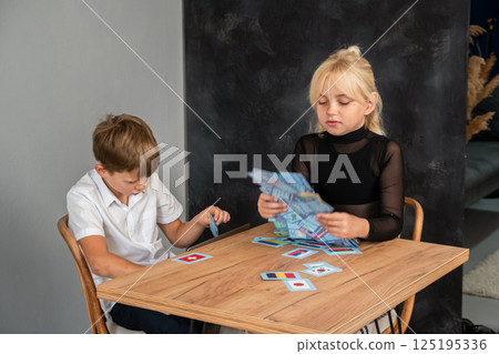 Children Playing Cards Table Game Indoor Fun Children Playing Cards Table Game Indoor Fun 125195336