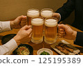 Businessman toasting with beer 125195389