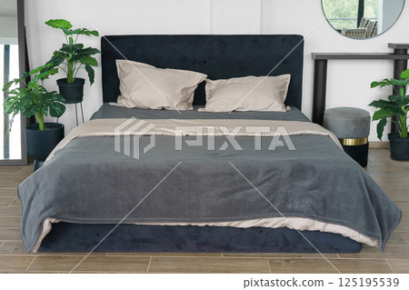 Cozy bedroom setting with pillows and cotton soft on black headboard background 125195539