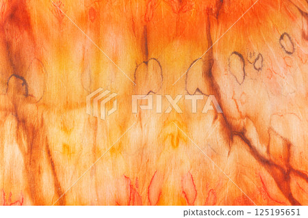 abstract pattern on silk fabric texture in yellow and brown tones abstract pattern on silk fabric texture in yellow and brown tones 125195651