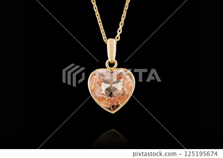 gold pendant with morganite stone on black background gold pendant with morganite stone on black background 125195674