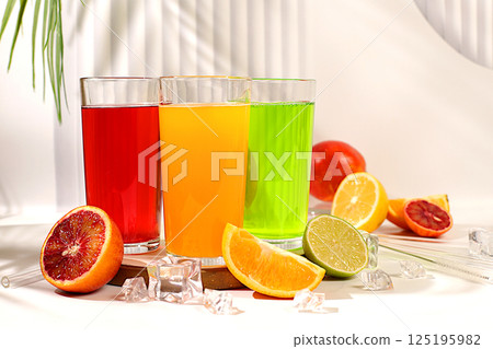 Modern still life with citrus fruits. Orange juice, thick smoothie and oranges, grapefruit, lime, blood orange and lemon on elegant kitchen table. Detox diet and weight loss concept, summer drinks, Modern still life with citrus fruits. Orange juice, thick smoothie and oranges, grapefruit, lime, blood orange and lemon on elegant kitchen table. Detox diet and weight loss concept, summer drinks, 125195982